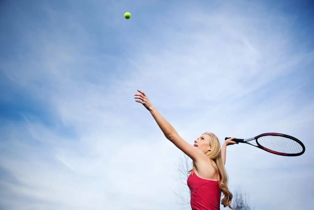 Practicing your second serve in tennis.