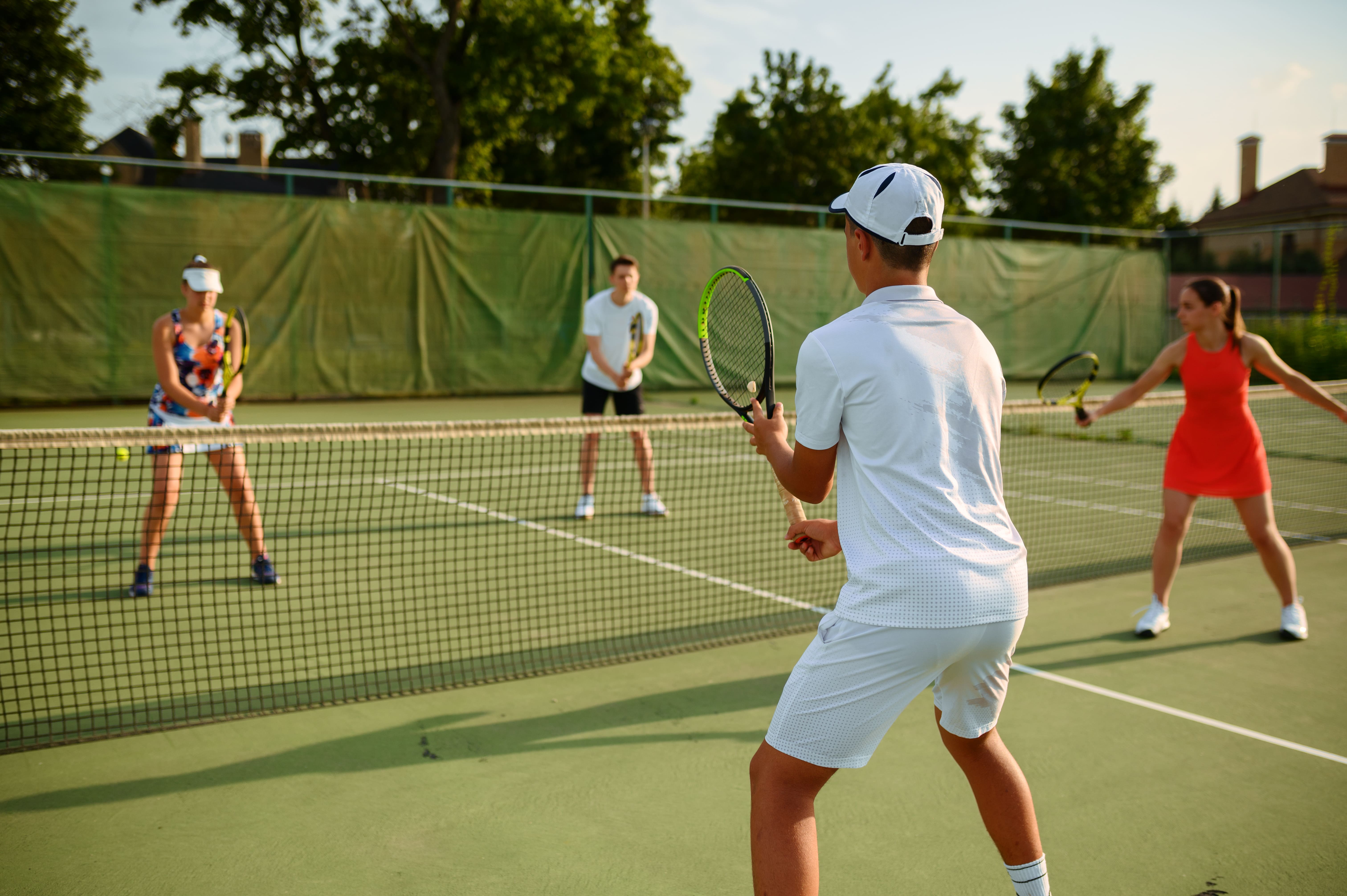 Photograph of doubles players warming up